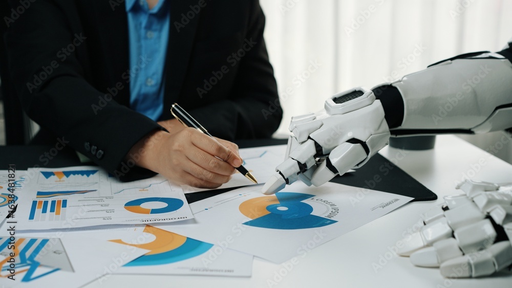 Poster a futuristic setting where a robot collaborates with a human, showcasing charts and graphs. this ima