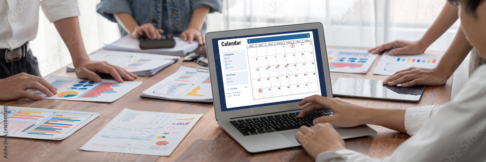 Poster calendar on computer software application for brisk schedule planning for personal organizer and onl