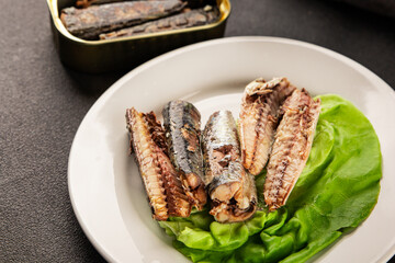 Sardine canned food sprats fish seafood fresh pescetarian diet gourmet food background on the table rustic food top view copy space keto and paleo diet