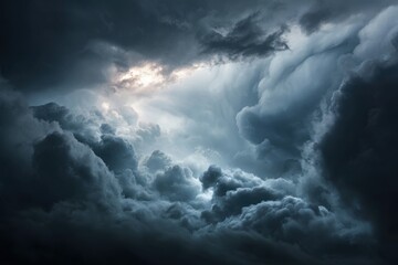 Obraz premium Dark moody sky with heavy layered storm clouds and dramatic lighting.