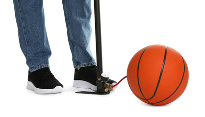 Man inflating basketball ball with manual air pump on white background, closeup