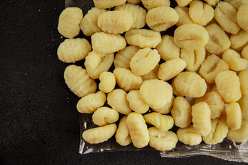 Gnocchi raw potato dough snack fresh delicious gourmet food background on the table  rustic food top view copy space vegetarian food