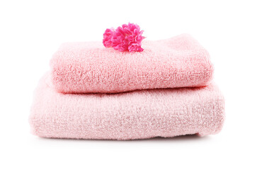 Soft towels and flower isolated on white