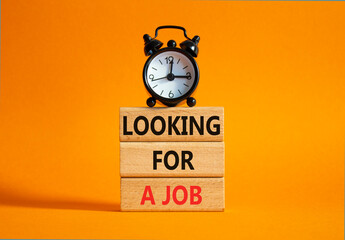 Looking for a job symbol. Concept words Looking for a job on wooden blocks. Beautiful orange...