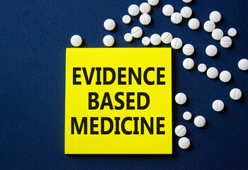Evidence Based Medicine symbol. Concept word Evidence Based Medicine on yellow note. Beautiful deep...