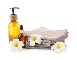 Spa composition with waffle towels and cosmetic products isolated on white