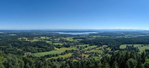 Obraz premium Panoramic view of a valley with lake and mountains