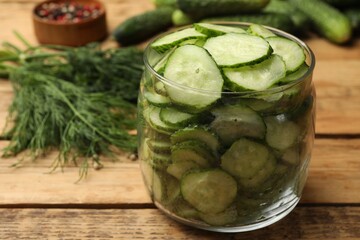 Making pickles. Fresh cucumbers and dill on wooden table, closeup