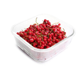 Frozen currants in glass container isolated on white