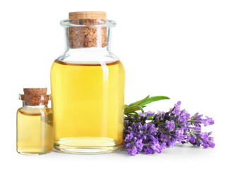 Lavender essential oil in bottles and flowers isolated on white