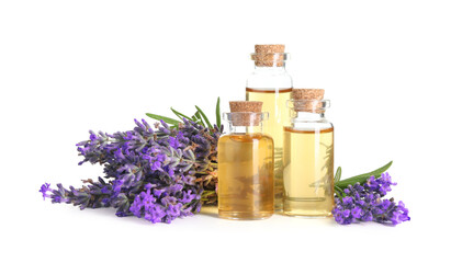 Lavender essential oil in bottles and flowers isolated on white