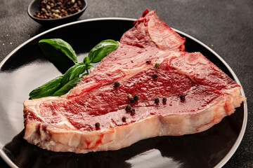 Raw steak T-bone fresh meat premium beef snack fresh delicious gourmet food background on the table rustic food top view copy space