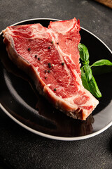 Raw steak T-bone fresh meat premium beef snack fresh delicious gourmet food background on the table rustic food top view copy space