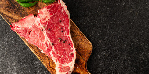 Raw steak T-bone fresh meat premium beef snack fresh delicious gourmet food background on the table...