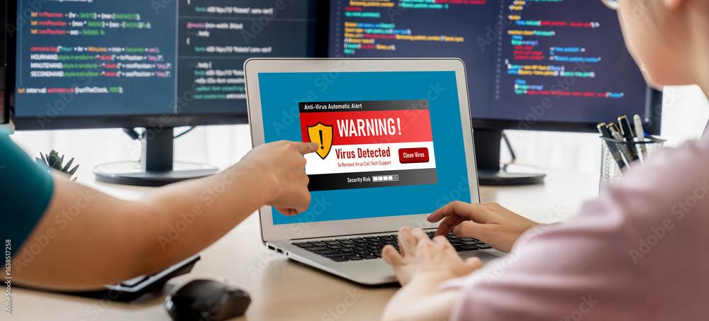 Poster virus warning alert on computer screen detected brisk cyber threat , hacker, computer virus and malw
