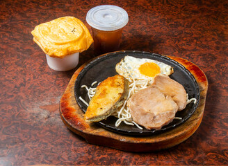 Fried Fish with Pork, Noodles, Egg, Soup, and Drink in plate side view of hong kong food