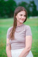 Fototapeta premium girl in summer meadow in grass. Concept of female dreams, success, travel, flight