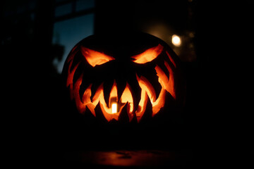 Naklejka premium Halloween Jack-o'-Lantern: Isolated Pumpkin on a Black Background 