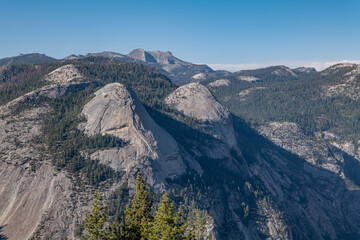 North Dome is Half Dome Granodiorite (Cretaceous). Glacier Point, Yosemite National Park, California. Sierra Nevada. Erosion and weathering. Yosemite Valley is a glacial valley.  
