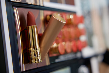 Close up of a lipstick tube with logo printed on it