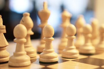 Chess pieces on a chessboard, strategic game