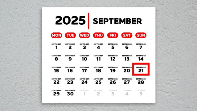 The date September 21st marked with a red cursor on the wall calendar 2025