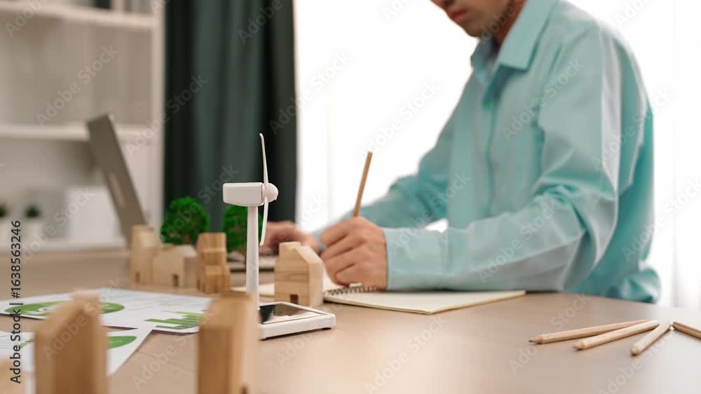 Poster windmill model represented using clean energy and wooden block symbolized ecology house. green power