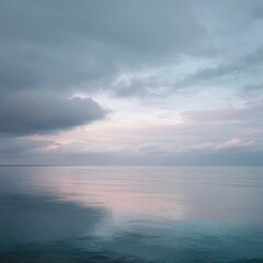 Fototapeta premium Calm sea sunset, moody sky, peaceful waters, coastal scene, nature backdrop