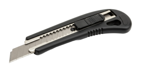 Cutting action with utility knife workshop space product clear focus on detail. Cut out png