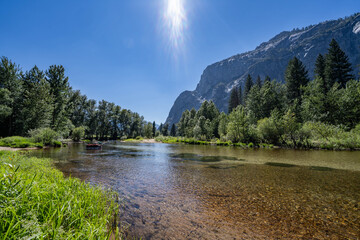 Yosemite National Park, Mariposa County, California. Sierra Nevada. Yosemite Valley is a glacial valley. The Merced River is a 145-mile (233 km)-long tributary of the San Joaquin River. 
