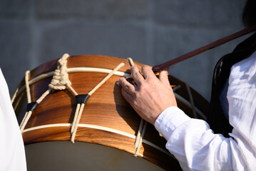 The warm wood tones of a traditional drum in the sunlight musical instrument concept