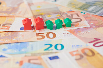 Red and green houses on Euro banknotes of different values