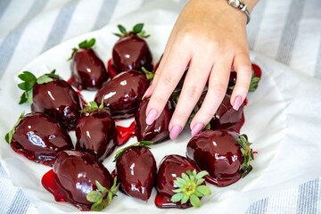 The most perfect sweet in the world, the iconic dessert strawberry of love on a stick, fresh strawberry, powdered milk brigadeiro and red caramel topping. Morango do amor