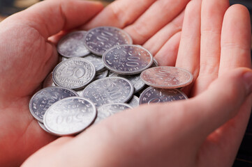 Holding Reichsmark coins in hands