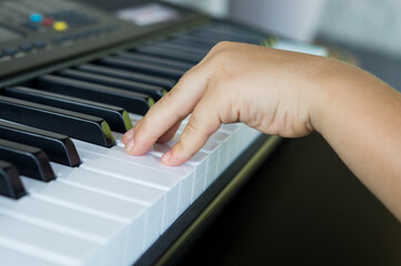 Little boy taking piano lessons