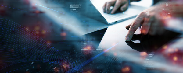 Hands interacting with a tablet and laptop, overlaid with digital data graphics, representing technology, innovation, analytics, and modern business in a connected world.