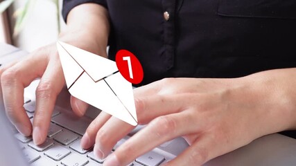 Focus on the hands of a businesswoman during her workday, with an animation of an envelope with the number one notification - Powered by Adobe