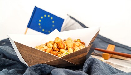Mixed nuts and other snacks in a disposable food container.