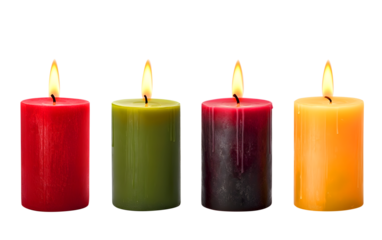 Four lit candles in various colors against a white background