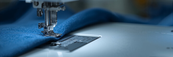 close up needle sewing machine fabric