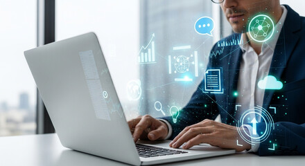 Businessman using laptop with digital icons overlaying the screen interface view