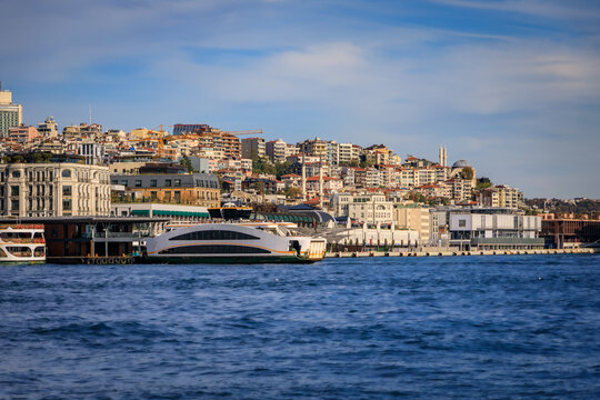 Galata Port waterfront with a ferry and Karakoy neighborhood in Istanbul, Turkey