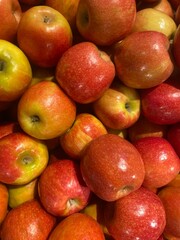 Fresh red apples with a glossy surface and rich color, perfect for concepts of organic farming, healthy eating, and fresh produce.