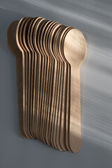 Stacked Wooden Spoons with Light Reflection