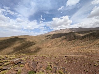Expansive mountain terrain under a bright sky in Atlas region