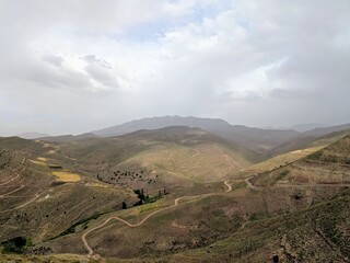 Obraz premium Mountainous landscape with winding roads in the Atlas Mountains