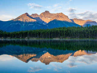 Golden sunrise reflection on Herbert Lake, Banff National Park