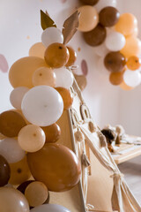 teepee and balloons birthday in boho style with rainbows