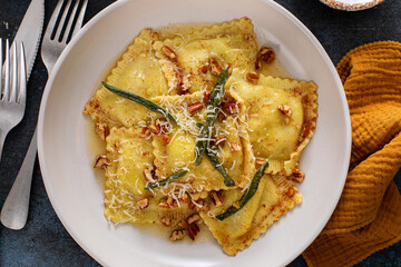 Pumpkin ravioli with brown butter pecan sauce and sage