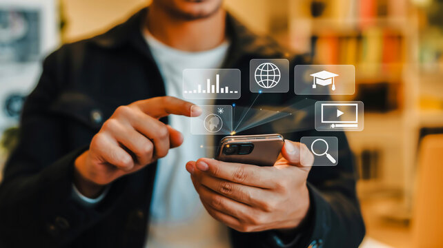 Man using smartphone with digital interface and education icons